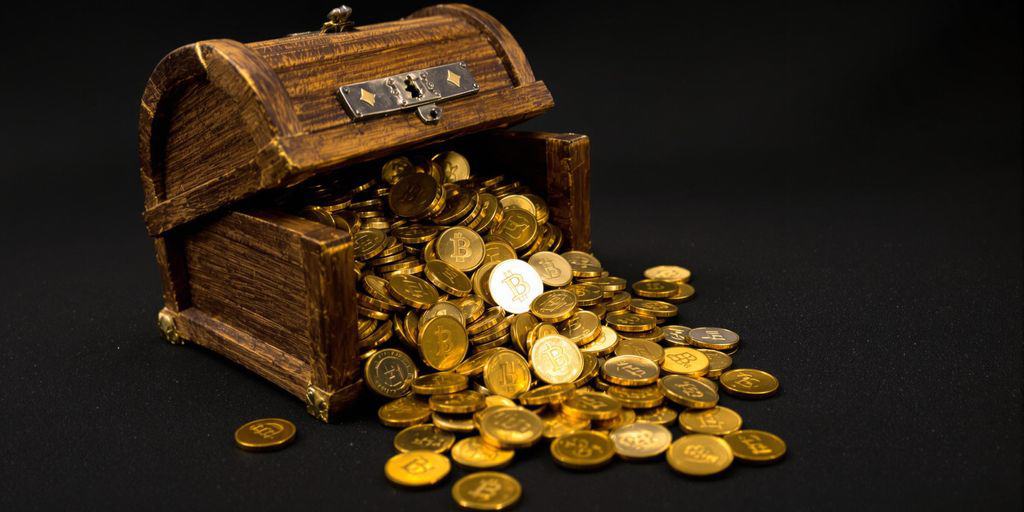 Golden coins spilling from a treasure chest.